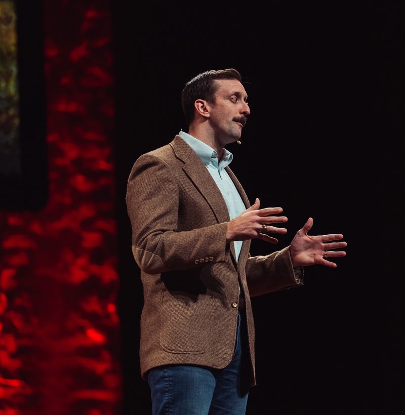 Stephen Hopkins speaking on stage